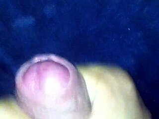 In the quiet room, a man indulges in solo pleasure with his cock, stroking rhythmically to build intense sensations.