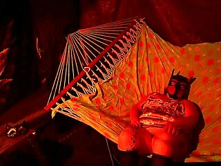 getting frisky in a tent, fingering her wet hole in a hammock