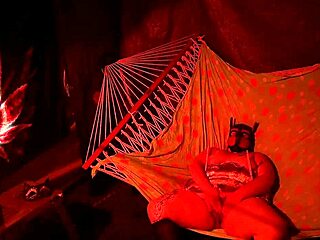 getting frisky in a tent, fingering her wet hole in a hammock