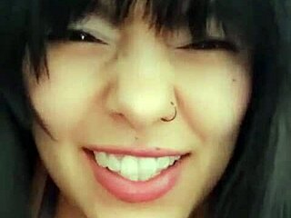 Latina woman chats with neighbor via video call and relaxes alone.