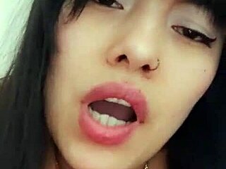 Latina woman chats with neighbor via video call and relaxes alone.