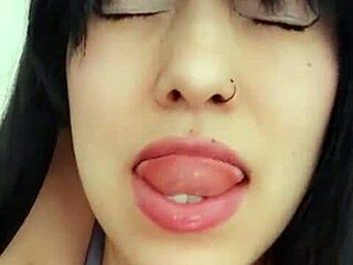 Latina woman chats with neighbor via video call and relaxes alone.