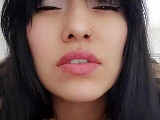 Latina woman chats with neighbor via video call and relaxes alone.