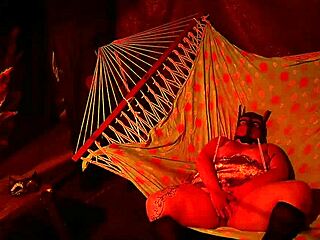 getting frisky in a tent, fingering her wet hole in a hammock