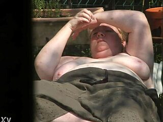 Relaxing Topless in the Sunny Garden