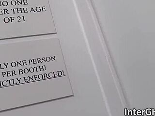 This ebony teen backs her ass up to the glory hole for interracial cock