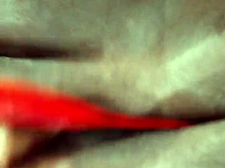 Ebony milf playing with dildo in lingerie, shaved pussy on display