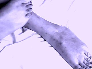 Sexy thick ebony girl gives footjob, making him cum all over her pretty feet.