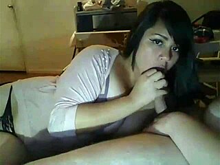 Wife narrates sucking husband's friend on webcam. Her cheating act unfolds during a wedding night.