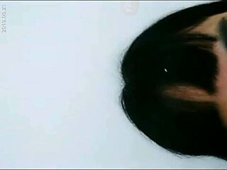 Hey, check out this hot Asian babe playing with her wet pussy using a bottle