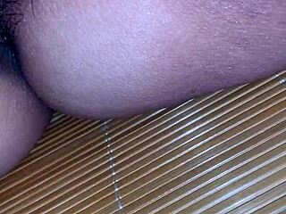 Vietnamese babe licks pussy while relaxing with a monster cock in view