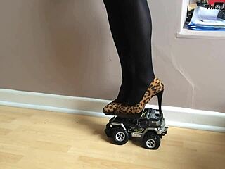 Woman's High Heels Crush Small Toy Car In The Garage Setting With Various Shoes And Toys.