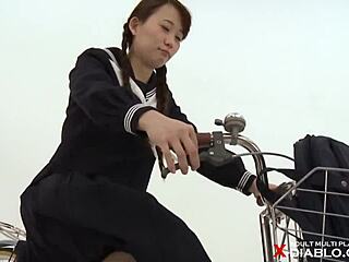 Japanese schoolgirl caught flashing panties while riding bike