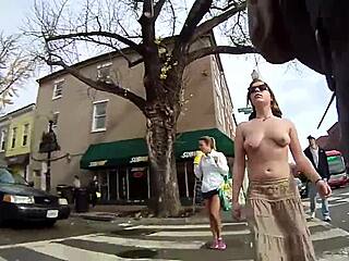 Girl walking topless around town with bold confidence in public spaces.