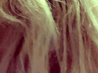 The wife is giving a great blowjob on webcam, her blonde hair bouncing as she sucks her husband's wet cock.