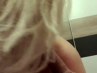 The wife is giving a great blowjob on webcam, her blonde hair bouncing as she sucks her husband's wet cock.