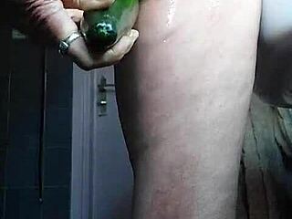 German granny fucks her pussy with a cucumber in solo play