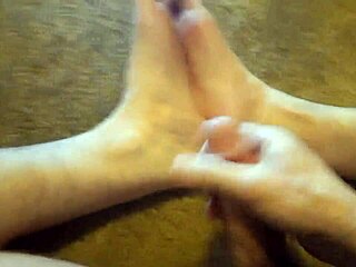 this hairy amateur cums on his own feet in a solo fetish session.