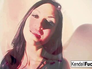 Kendall pulls off a sexy tease with a stock fetish vibe