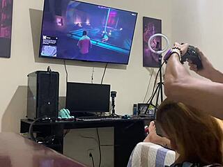 Petite brunette sucks him intensely while he plays video game!