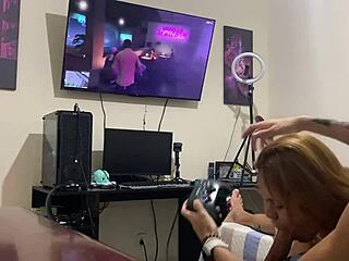 Petite brunette sucks him intensely while he plays video game!