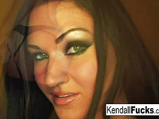 Kendall pulls off a sexy tease with a stock fetish vibe