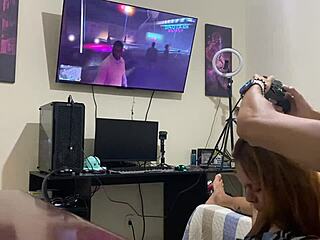 Petite brunette sucks him intensely while he plays video game!