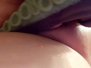 Shaved kitty playing with her tight pussy