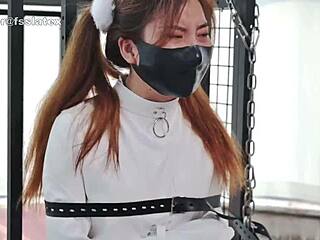 Asian Woman in Latex Catsuit Bound Tight in Straitjacket