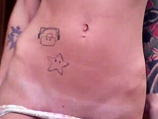 Tattooed Slut Fingers Herself In Bathroom