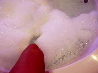 Petite teen babe masturbates with dildo in the bath, inviting you to join