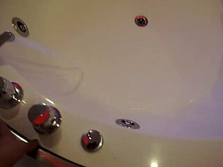 Petite teen babe masturbates with dildo in the bath, inviting you to join