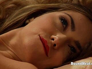 is the sensual lesbian madame in red lingerie masturbating hard?