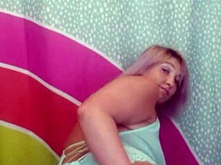 Suzie milf strips naked to show her big tits