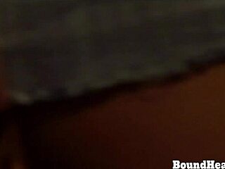 A dominant woman and her partner soft lovemaking between them with a strapon