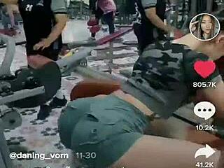 Asian girl stretching her tight ass during an intense outdoor workout session