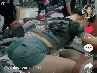 Asian girl stretching her tight ass during an intense outdoor workout session