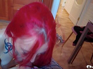 Tattooed teen on knees in kitchen sucking cock?