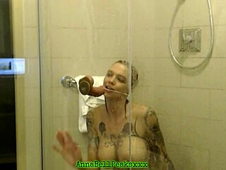 Wow! Hot Tattooed Milf Teases with Big Tits in Steamy Shower Scene!