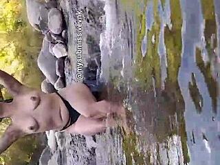 Argentinian Brunette Flashes Natural Tits While Bathing in River and Touches Herself
