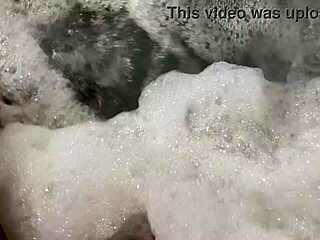 Sister-in-law gives oral in bathtub with shaved pussy