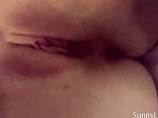 Sunny Lane Poses And Rubs Her Shaved Pussy With Big Clit In Solo Masturbation Clip
