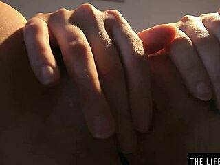 natural beauty's big tits jiggle while she subtly strokes her hairy pussy in stockings