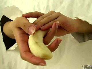Asian Fetish Babe Crushes Banana with Hands in Messy Handjob Action
