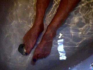 Cutie plays with huge dildo in bathroom homemade