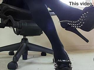 Sexy close-up shoe dangle in pantyhose