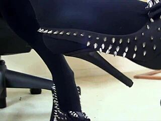 Sexy close-up shoe dangle in pantyhose