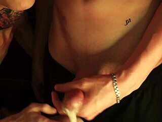 Twink performs blowjob through glory hole