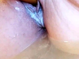 she's dildoing herself in the bathtub so wet