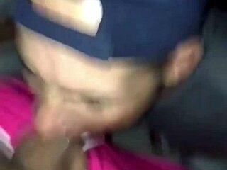 Young teen sucks older man in club bathroom, swallowing cum.